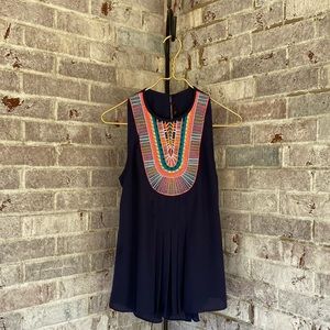 Anthropologie navy, sleeveless top with colorful stitching in tribal pattern.